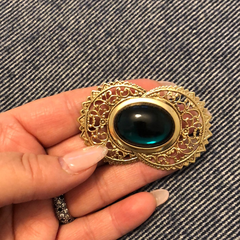 Vintage crescent moon with green stone